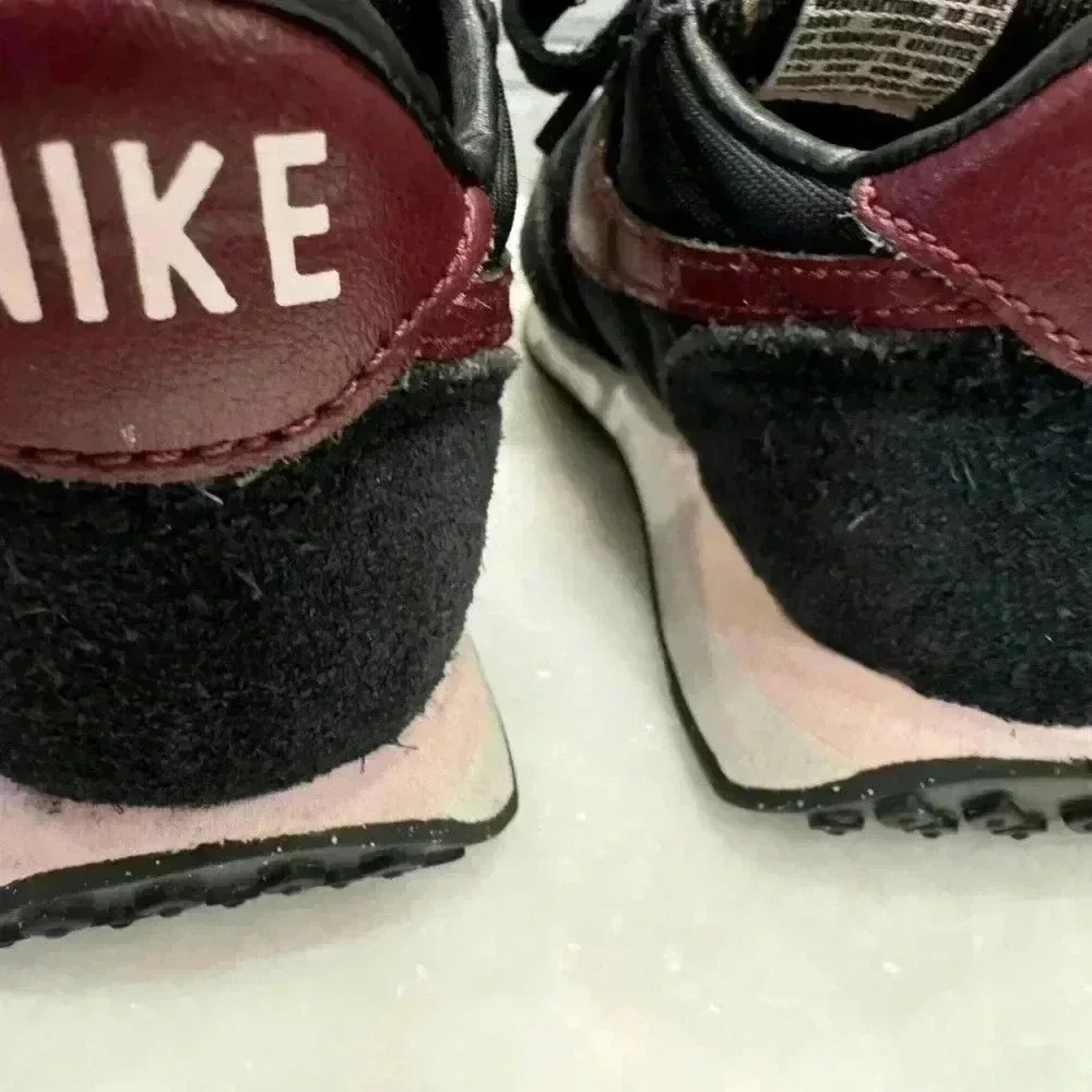 Nike baby girl suede sneakers size 6c. Black with burgandy nike logo.